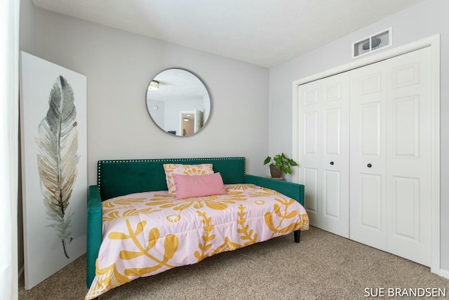 carpeted bedroom with a closet