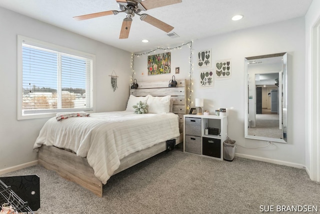 bedroom featuring ceiling fan and carpet