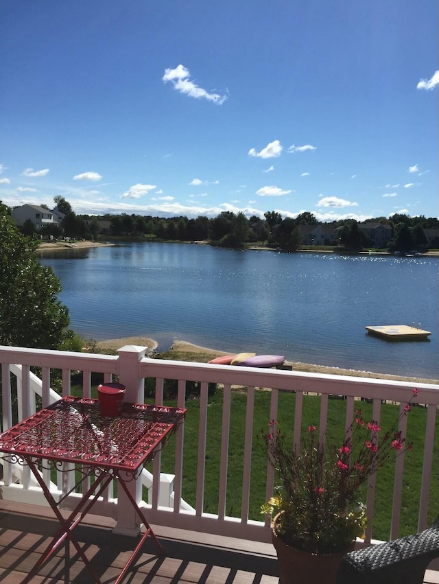 balcony featuring a water view