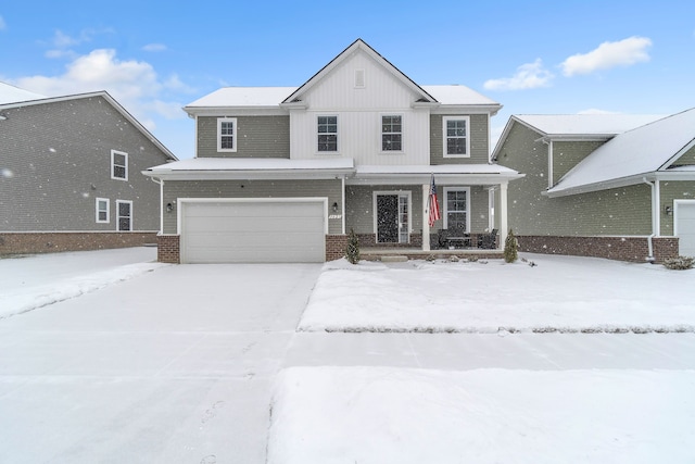 view of front of home featuring a garage and a porch