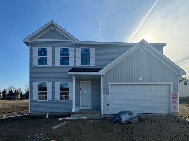 view of front of home with board and batten siding and an attached garage