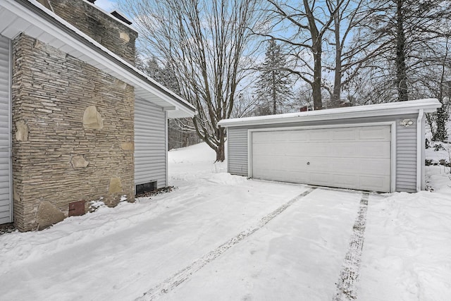 view of snow covered garage