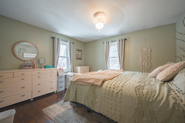 bedroom featuring ceiling fan and dark hardwood / wood-style flooring