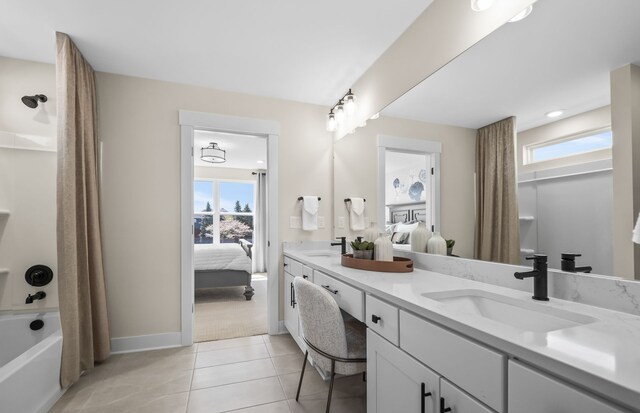 bathroom with tile patterned floors, vanity, and shower / tub combo with curtain