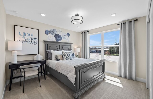 bedroom with light colored carpet