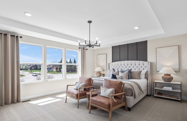 bedroom with light colored carpet, multiple windows, and an inviting chandelier