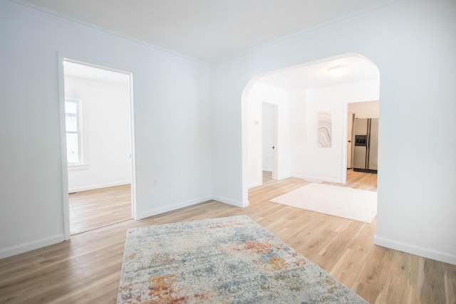 unfurnished room with wood-type flooring