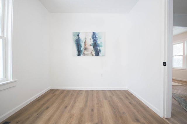 unfurnished room featuring wood-type flooring