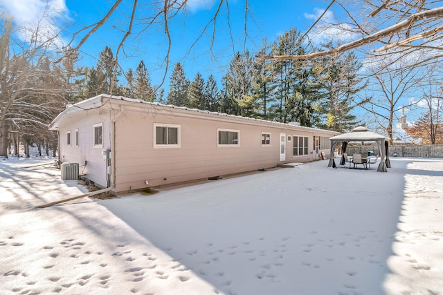 snow covered property featuring a gazebo