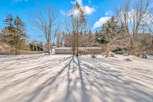 view of yard layered in snow