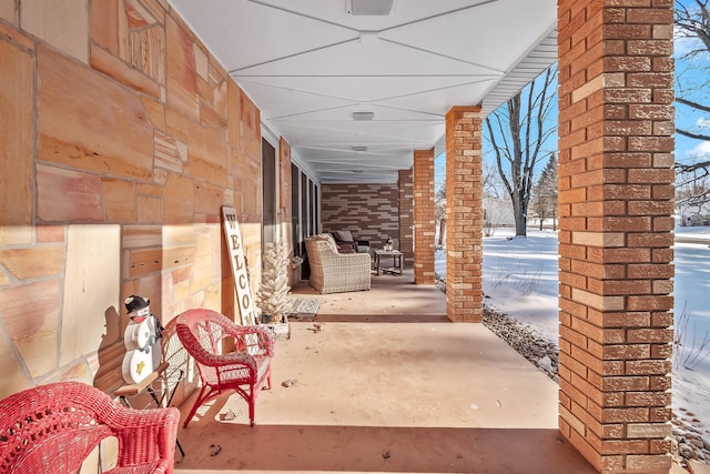 view of snow covered patio