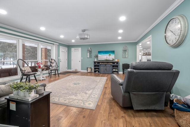 living room with light hardwood / wood-style flooring and ornamental molding