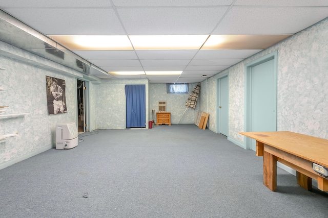 basement with carpet flooring and a drop ceiling