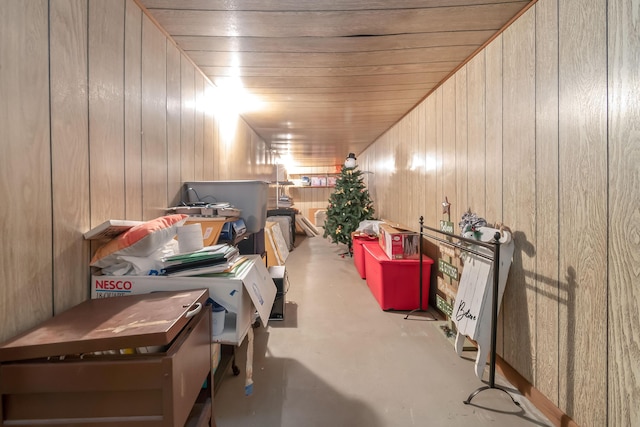 interior space with wood ceiling and wood walls