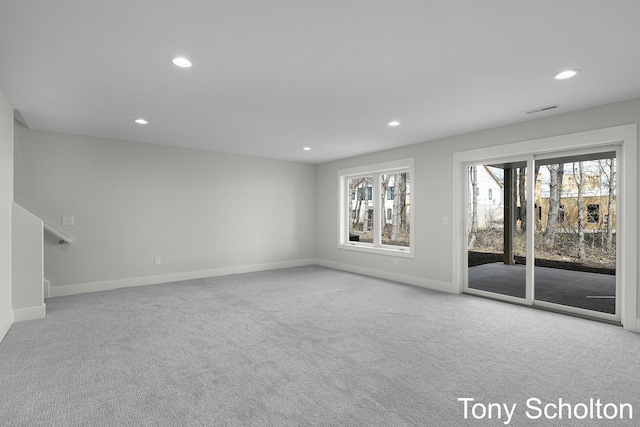 unfurnished living room with carpet floors, recessed lighting, baseboards, and visible vents