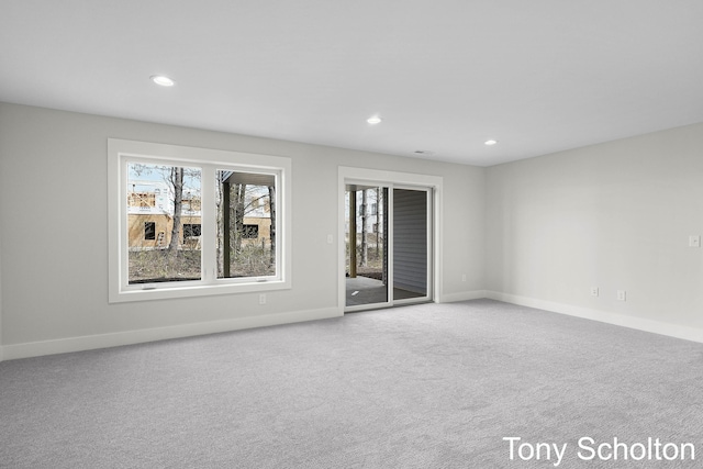 carpeted spare room with recessed lighting and baseboards