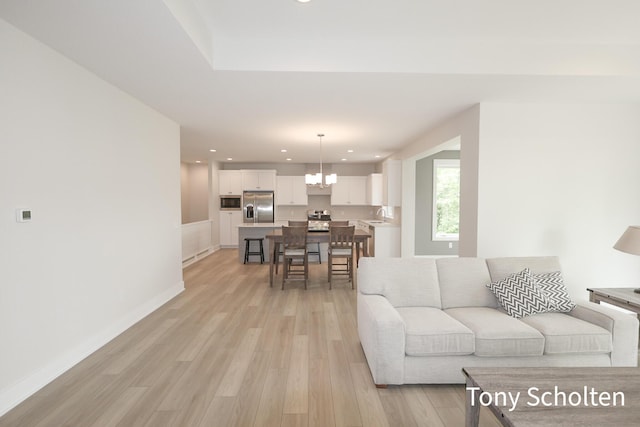 5157 Blendon Wds Ct Unit 15, Hudsonville, MI 49426 - living area with recessed lighting, light wood-style floors, a chandelier, and baseboards