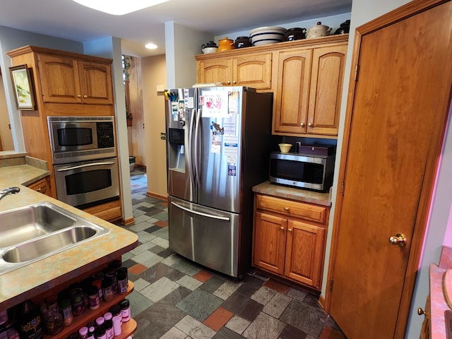 kitchen featuring appliances with stainless steel finishes and sink