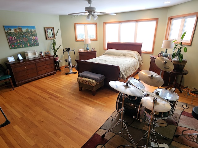 bedroom featuring ceiling fan and light wood-type flooring