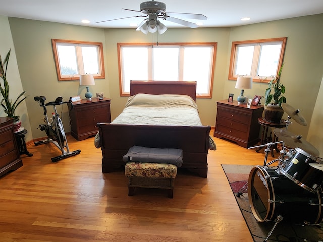 bedroom featuring ceiling fan and light hardwood / wood-style flooring