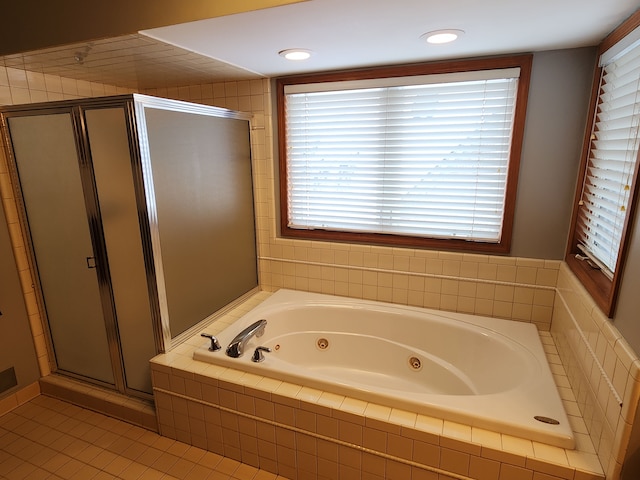 bathroom featuring tile patterned floors and plus walk in shower