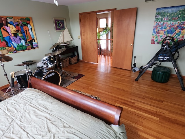 bedroom with hardwood / wood-style floors