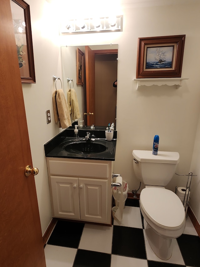 bathroom featuring toilet and vanity