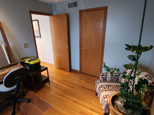 office with light hardwood / wood-style floors