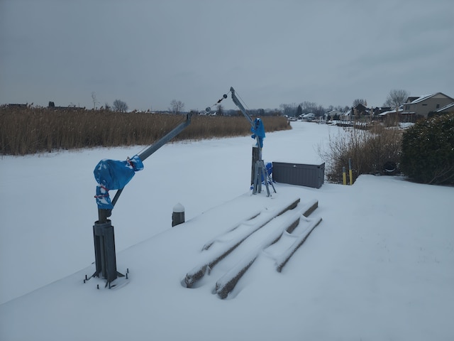 view of yard layered in snow