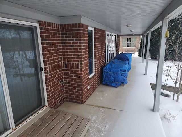 view of snow covered patio