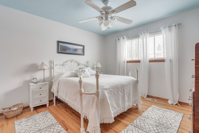 bedroom featuring ceiling fan and light wood-type flooring