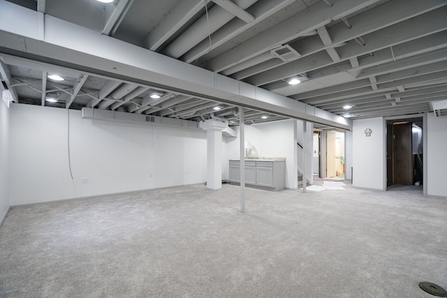 basement with light colored carpet