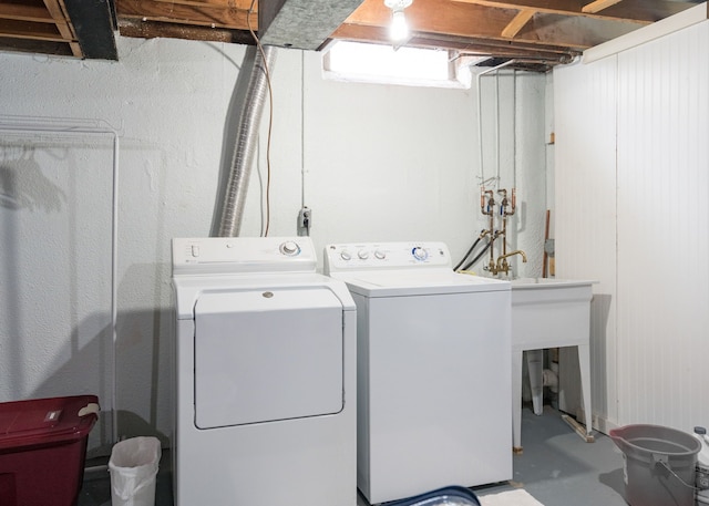 laundry area with independent washer and dryer