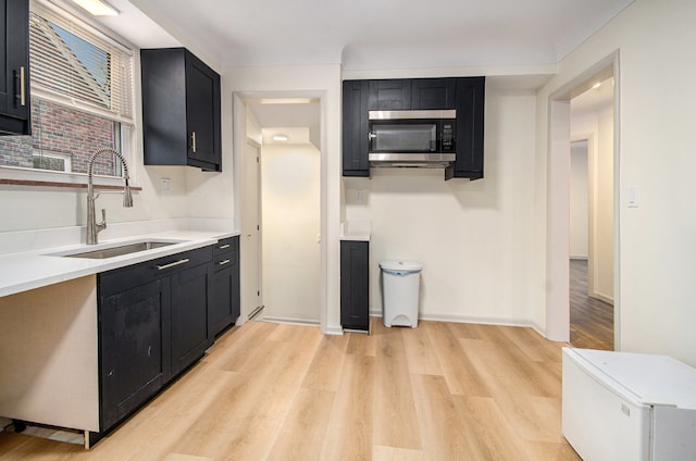 kitchen with sink and light wood-type flooring