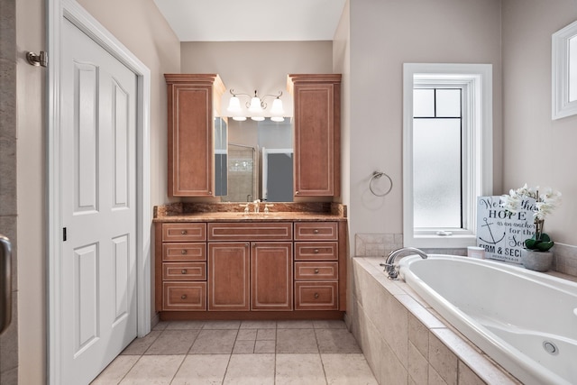 bathroom with tile patterned flooring, separate shower and tub, and vanity