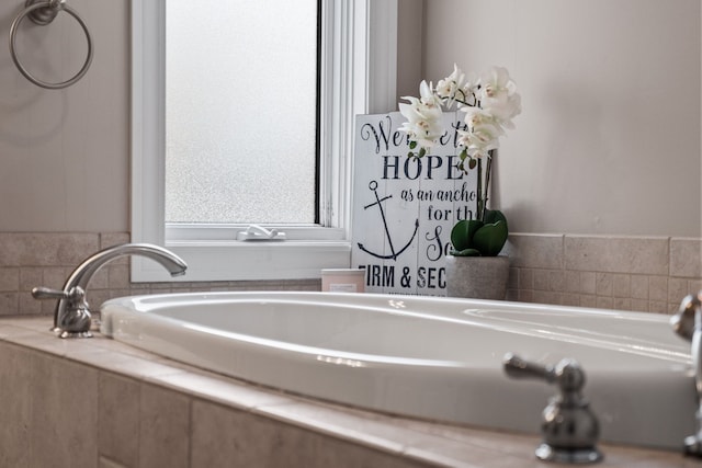 bathroom featuring tiled bath