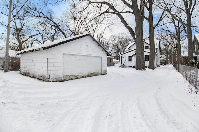 view of snow covered garage