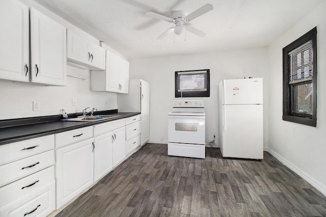 kitchen with white appliances, dark wood-type flooring, white cabinetry, sink, and ceiling fan