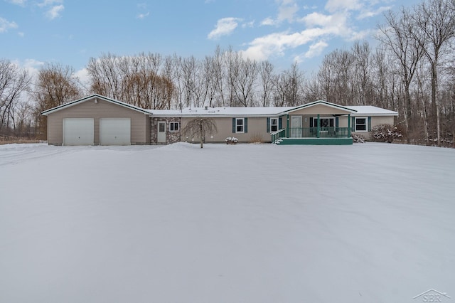 view of front facade featuring a porch and a garage