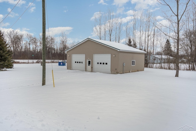 view of snow covered garage