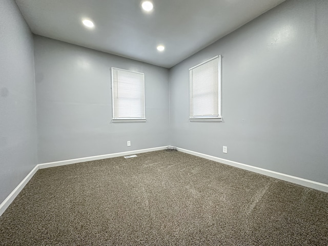 spare room featuring carpet