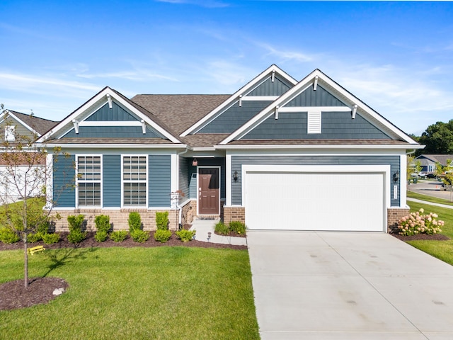 craftsman-style home with a front yard and a garage