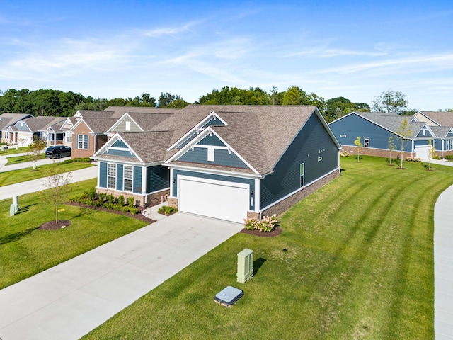 view of front of property featuring a garage and a front yard