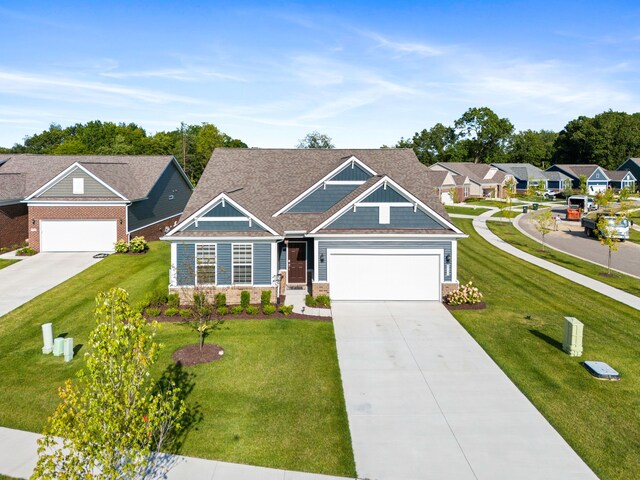 view of front facade featuring a front yard and a garage