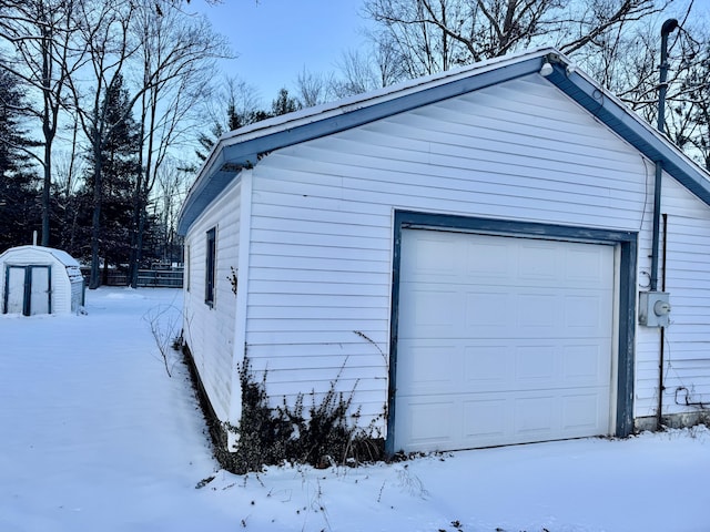 view of snow covered garage