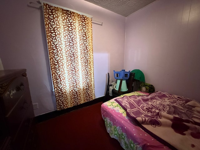 bedroom featuring a textured ceiling