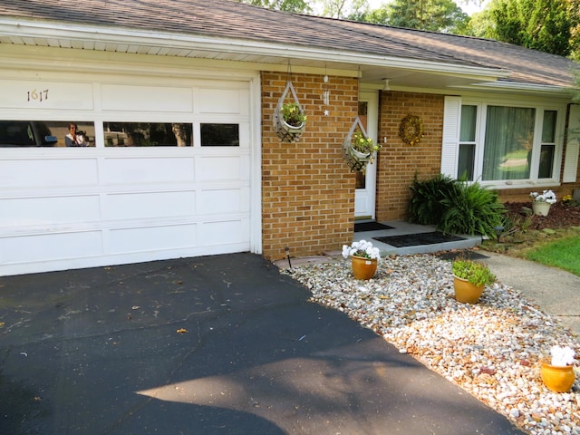 entrance to property with a garage