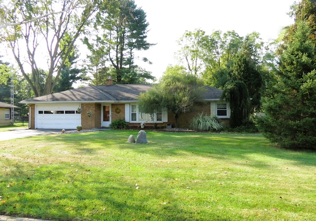 single story home featuring a front lawn and a garage