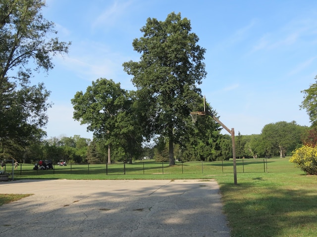 view of home's community with a lawn