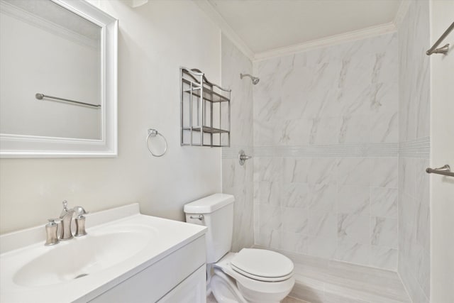 bathroom featuring toilet, ornamental molding, a tile shower, and vanity